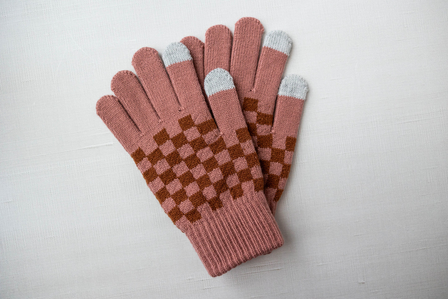 checkered gloves in soft pink
