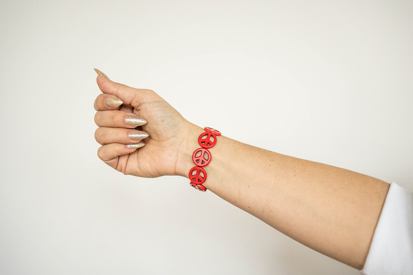 Load image into Gallery viewer, red peace sign bracelet by sundrenchd
